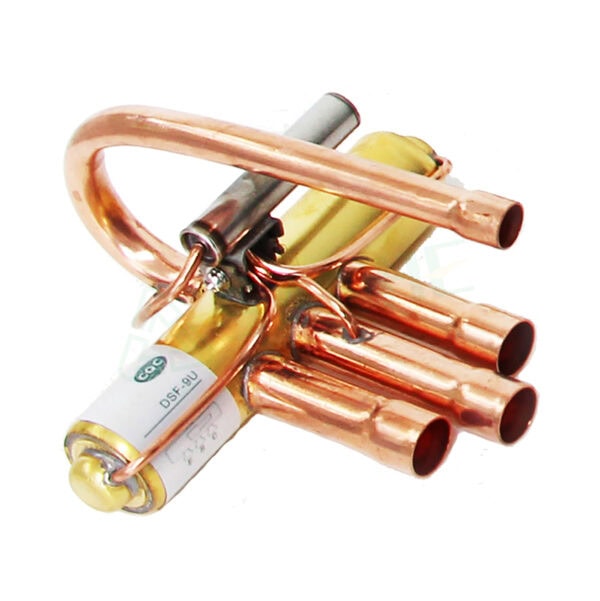Close-up of HVAC compressor component with copper pipes and electrical connections, used in heating, ventilation, and air conditioning systems.